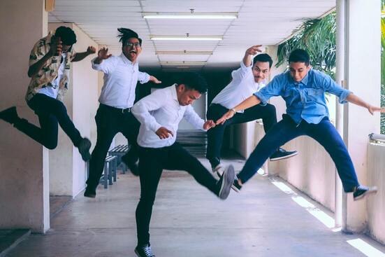 Work colleagues jumping for joy, excited about their careers