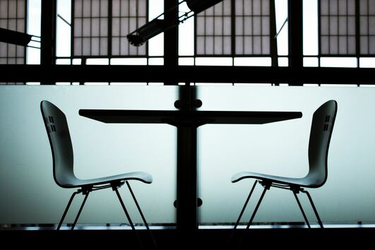 A table and two chairs set up for a career coaching session